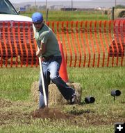 Raking the dirt. Photo by Dawn Ballou, Pinedale Online.