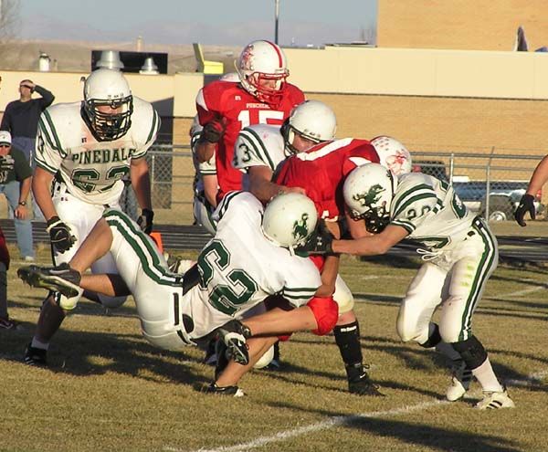 Making the tackle. Photo by Dawn Ballou, Pinedale Online.