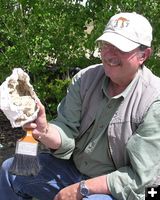 Sam Drucker with bison bones. Photo by Dawn Ballou, Pinedale Online.
