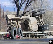 Trailer on bridge rail. Photo by Dawn Ballou, Pinedale Online.