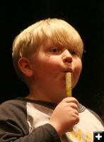 Playing the flute. Photo by Pam McCulloch, Pinedale Online.