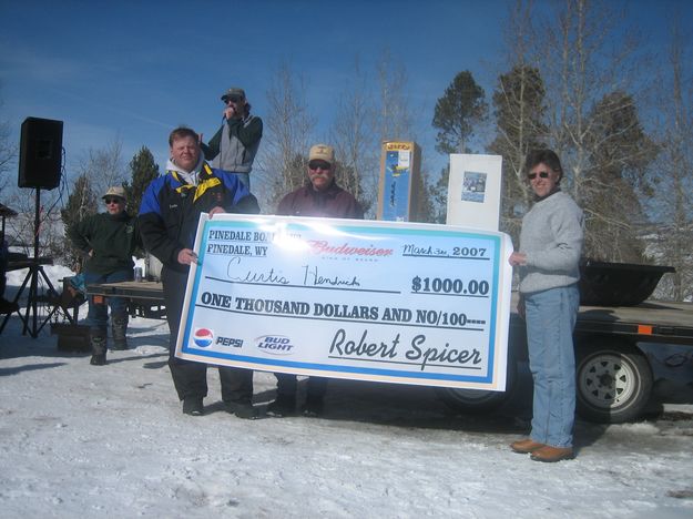 Curtis Hendricks $1000 Check. Photo by Bill Boender.