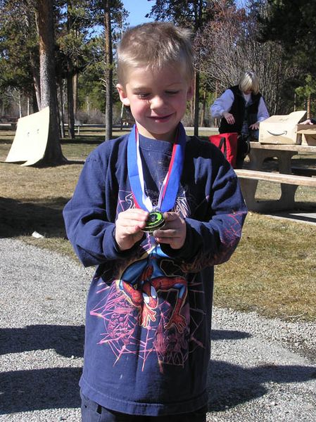 Tanner shows off his medals. Photo by Dawn Ballou, Pinedale Online.