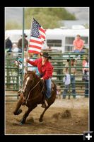 Carrying the Flag. Photo by Tara Bolgiano, Blushing Crow Photography.