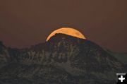 Moon behind Jackson Pk. Photo by Dave Bell.