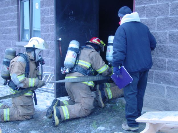 Keeping low at the door. Photo by Sublette County Fire Board.