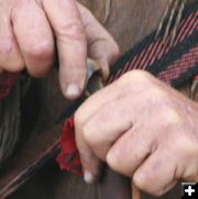 Pouring black powder into barrel. Photo by Dawn Ballou, Pinedale Online.