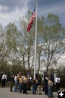 Raising the flag. Photo by Dawn Ballou, Pinedale Online.