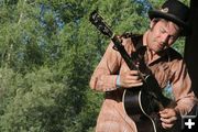 Crossland on the guitar. Photo by Tim Ruland, Pinedale Fine Arts Council.