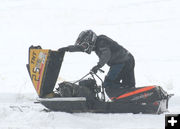 Sled 25-Looking under the hood. Photo by Dawn Ballou, Pinedale Online.