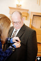 Putting on his badge. Photo by Tara Bolgiano.