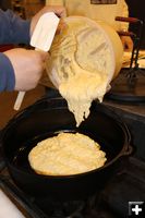 Pouring batter. Photo by Dawn Ballou, Pinedale Online.