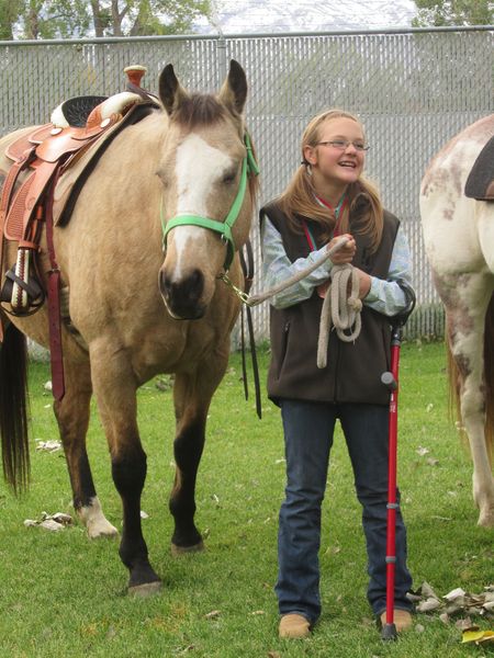 MaKinzie & Buck. Photo by M.E.S.A. Therapeutic Horsemanship, Inc..