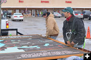 Putting on brackets. Photo by Terry Allen.