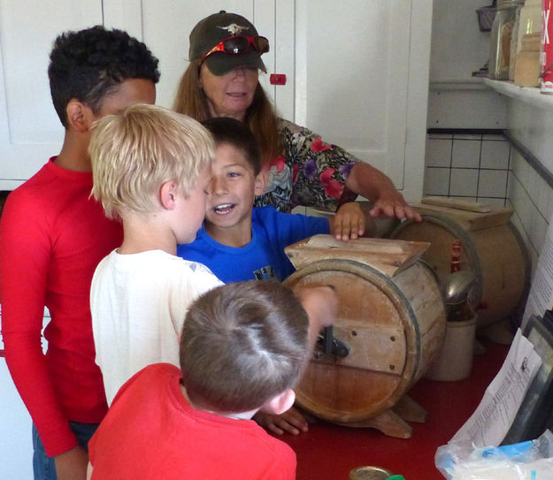 Churning butter. Photo by Clint Gilchrist.