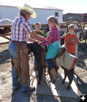 Saddling a horse. Photo by Clint Gilchrist.