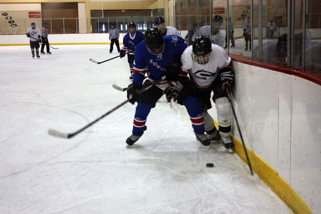 Mitchell fights for puck. Photo by Nan Stinson.