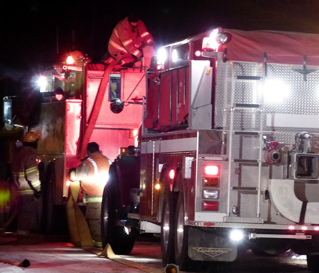 Putting hoses away. Photo by Dawn Ballou, Pinedale Online.