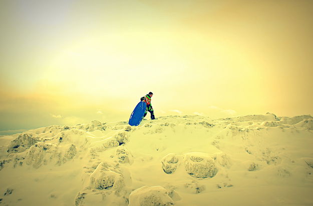 Boy on a Sled Hill. Photo by Terry Allen.