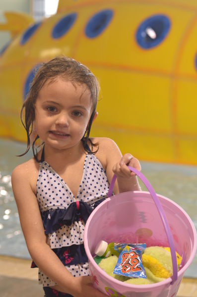 Kinslee Miles Shows Her Basket. Photo by Terry Allen.