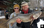 Proud Dad holds Sons Fish. Photo by Terry Allen.