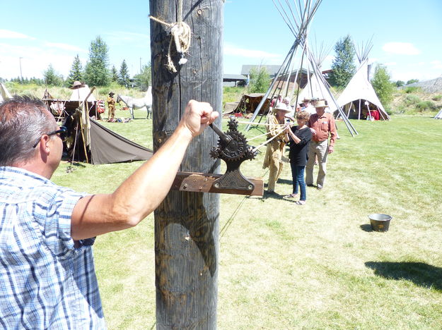 Spinning an elk rawhide tow rope. Photo by Dawn Ballou, Pinedale Online.