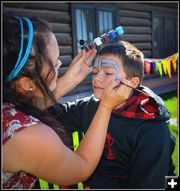 Face Painting by Mae. Photo by Terry Allen.