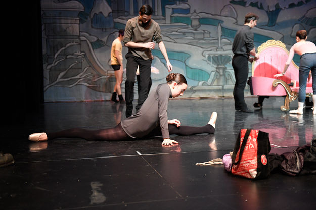 Stretching prior to performance. Photo by Arnold Brokling.