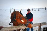 Tony Giving a Good Rub on Hitching Rail. Photo by Terry Allen.