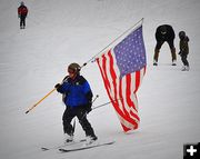 Courtney Takes the Flag Down. Photo by Terry Allen.