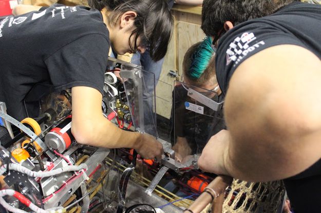 Working on the robot. Photo by Big Piney Robotics.