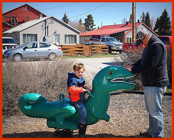 Thomas Rides the Dino. Photo by Terry Allen.