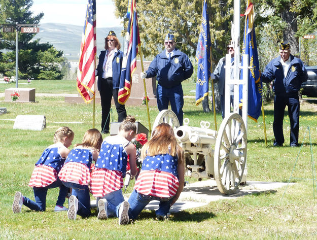 Placing Flowers. Photo by Dawn Ballou, Pinedale Online.