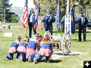 Placing Flowers. Photo by Dawn Ballou, Pinedale Online.