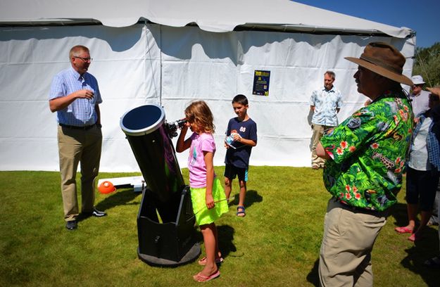 Dace and Gwen Look at Sunspots at Museum of the Mountain Man. Photo by Terry Allen.