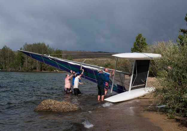 Righting the boat. Photo by Rita Donham.