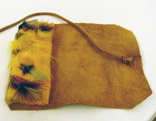 Flies in leather case. Photo by Dawn Ballou, Pinedale Online.