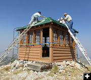 Painting the roof. Photo by Dawn Ballou, Pinedale Online.