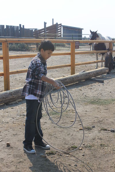 Learning to hold the rope. Photo by Dawn Ballou, Pinedale Online.